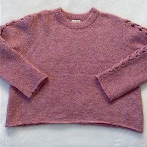 Pink sweater with detail on the arms